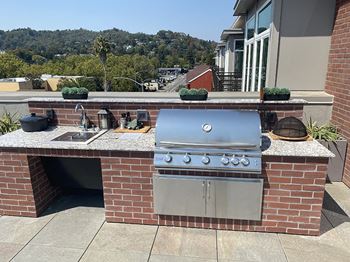 Rooftop BBQ area with seating at Second & B Street, San Rafael
